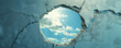 © NK - Hole in a broken wall revealing blue sky with clouds, abstract concept