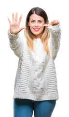 Poster - Young beautiful woman casual white sweater over isolated background showing and pointing up with fingers number six while smiling confident and happy.