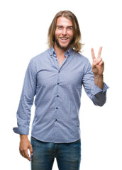 Canvas Print - Young handsome man with long hair over isolated background smiling with happy face winking at the camera doing victory sign. Number two.