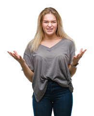 Poster - Young caucasian woman over isolated background crazy and mad shouting and yelling with aggressive expression and arms raised. Frustration concept.