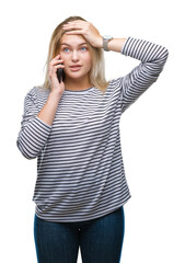 Sticker - Young caucasian woman showing smartphone screen over isolated background stressed with hand on head, shocked with shame and surprise face, angry and frustrated. Fear and upset for mistake.