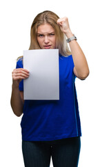 Poster - Young caucasian woman holding blank paper sheet over isolated background annoyed and frustrated shouting with anger, crazy and yelling with raised hand, anger concept