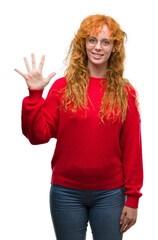 Sticker - Young redhead woman wearing red sweater showing and pointing up with fingers number five while smiling confident and happy.