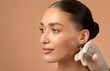 © Home-stock - Cosmetologist making rejuvenating anti wrinkle injections on young woman face. Female aesthetic cosmetology in a beauty salon. Free space