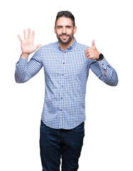 Young handsome man over isolated background showing and pointing up with fingers number six while smiling confident and happy.