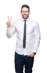 Canvas Print - Young handsome business man wearing glasses over isolated background showing and pointing up with fingers number two while smiling confident and happy.