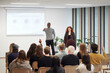 © Johnér - Multiracial colleagues giving presentation to employees in office