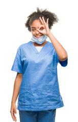 Poster - Young afro american doctor woman over isolated background doing ok gesture with hand smiling, eye looking through fingers with happy face.