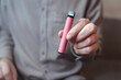 © Johnér - Close-up of man holding vape pen in hand