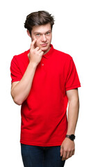 Sticker - Young handsome man wearing red t-shirt over isolated background Pointing to the eye watching you gesture, suspicious expression