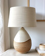 © Aisyaqilumar - Handmade ceramic table lamp using glazed pottery material. Lampshade is made of fabric.