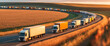 © Pavel Lysenko - A long line of semi-trucks travel down a winding road through a field of golden wheat. The setting sun casts a warm glow on the scene, creating a sense of tranquility