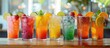 © Zam - Refreshing Summer Cocktails. Line of Colorful Cocktails Garnished with Fruit