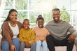 © peopleimages.com - Portrait smile, black family and relax on sofa with bonding, love and support in home. African parents, young children and happy together in living room for weekend, trust and relationship care