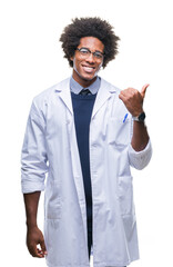 Wall Mural - afro american doctor scientist man over isolated background smiling with happy face looking and poin