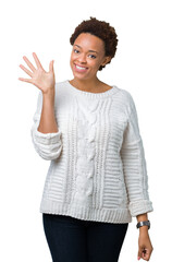 Sticker - Beautiful young african american woman wearing sweater over isolated background showing and pointing up with fingers number five while smiling confident and happy.