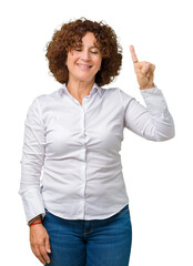 Poster - Beautiful middle ager senior businees woman over isolated background showing and pointing up with finger number one while smiling confident and happy.