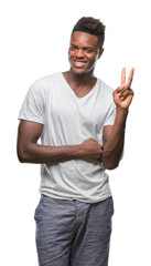 Canvas Print - Young african american man over isolated background smiling with happy face winking at the camera doing victory sign. Number two.