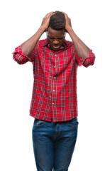 Sticker - Young african american man over isolated background suffering from headache desperate and stressed because pain and migraine. Hands on head.