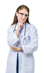 Sticker - Middle age mature doctor woman wearing medical coat over isolated background with hand on chin thinking about question, pensive expression. Smiling with thoughtful face. Doubt concept.