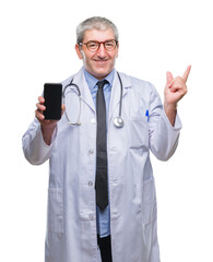 Poster - Handsome senior doctor man showing screen of smarpthone over isolated background very happy pointing with hand and finger to the side