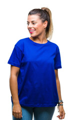 Sticker - Young beautiful woman wearing casual blue t-shirt over isolated background looking away to side with smile on face, natural expression. Laughing confident.