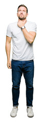 Sticker - Handsome man wearing casual white t-shirt Touching painful neck, sore throat for flu, clod and infection