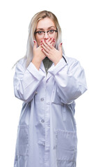 Sticker - Young blonde doctor woman over isolated background shocked covering mouth with hands for mistake. Secret concept.