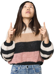 Poster - Young Chinese woman pointing upside with opened mouth.