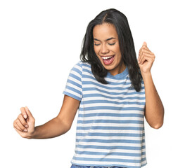 Wall Mural - young latina posing in studio dancing and having fun.