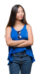 Sticker - Young asian woman over isolated background smiling looking side and staring away thinking.