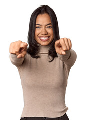 Wall Mural - Young filipino woman cheerful smiles pointing to front.