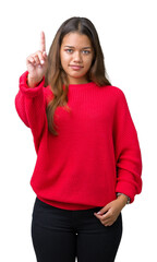 Sticker - Young beautiful brunette woman wearing red winter sweater over isolated background Pointing with finger up and angry expression