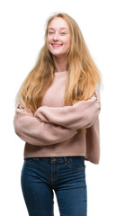 Poster - Blonde teenager woman wearing pink sweater happy face smiling with crossed arms looking at the camera. Positive person.