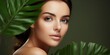 © Graphic Warrior - Pretty attractive female girl face portrait on green leave background. Skin care wellness health