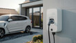 © Studio Zenith - voiture électrique branchée à une borne en train de recharger à domicile