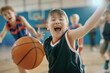 © Bonsales - Boy with Down syndrome playing basketball with other children in a gym. Child's enthusiastic expression and dynamic pose create a joyful and inclusive atmosphere