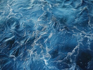 Wall Mural - The image is of a body of water with a lot of bubbles. The bubbles are scattered throughout the water, creating a sense of movement and energy