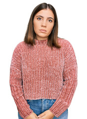 Canvas Print - Young beautiful woman wearing casual clothes relaxed with serious expression on face. simple and natural looking at the camera.