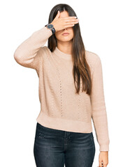 Sticker - Young brunette woman wearing casual winter sweater covering eyes with hand, looking serious and sad. sightless, hiding and rejection concept