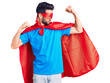 © Krakenimages.com - Young handsome man with beard wearing super hero costume showing arms muscles smiling proud. fitness concept.