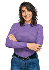 Wall Mural - Young hispanic woman wearing casual clothes happy face smiling with crossed arms looking at the camera. positive person.