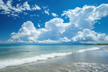 Poster - Picturesque landscape featuring a tranquil beach and vibrant blue sky with fluffy white clouds