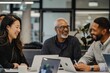 © utaem2022 - Group of People Sitting Around a Table With Laptops