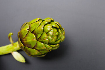 Poster - Purple artichoke on dark background.