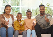 © peopleimages.com - Portrait, family and children on sofa with thumbs up for relax, support or bonding together on weekend. Love, young kids and happy man with black woman in living room for agree, yes or trust in home