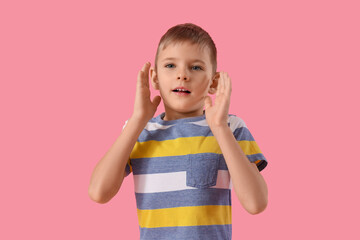 Wall Mural - Shocked little boy on pink background