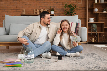 Sticker - Father and his daughter with jar, mortar board and money at home. Tuition fees concept