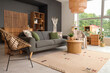 © Pixel-Shot - Wicker chairs, comfortable sofa and table in interior of stylish living room