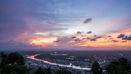 Wall Mural - twilight and dawn sky with cumulus cloud time lapse in an evening at a small town.
